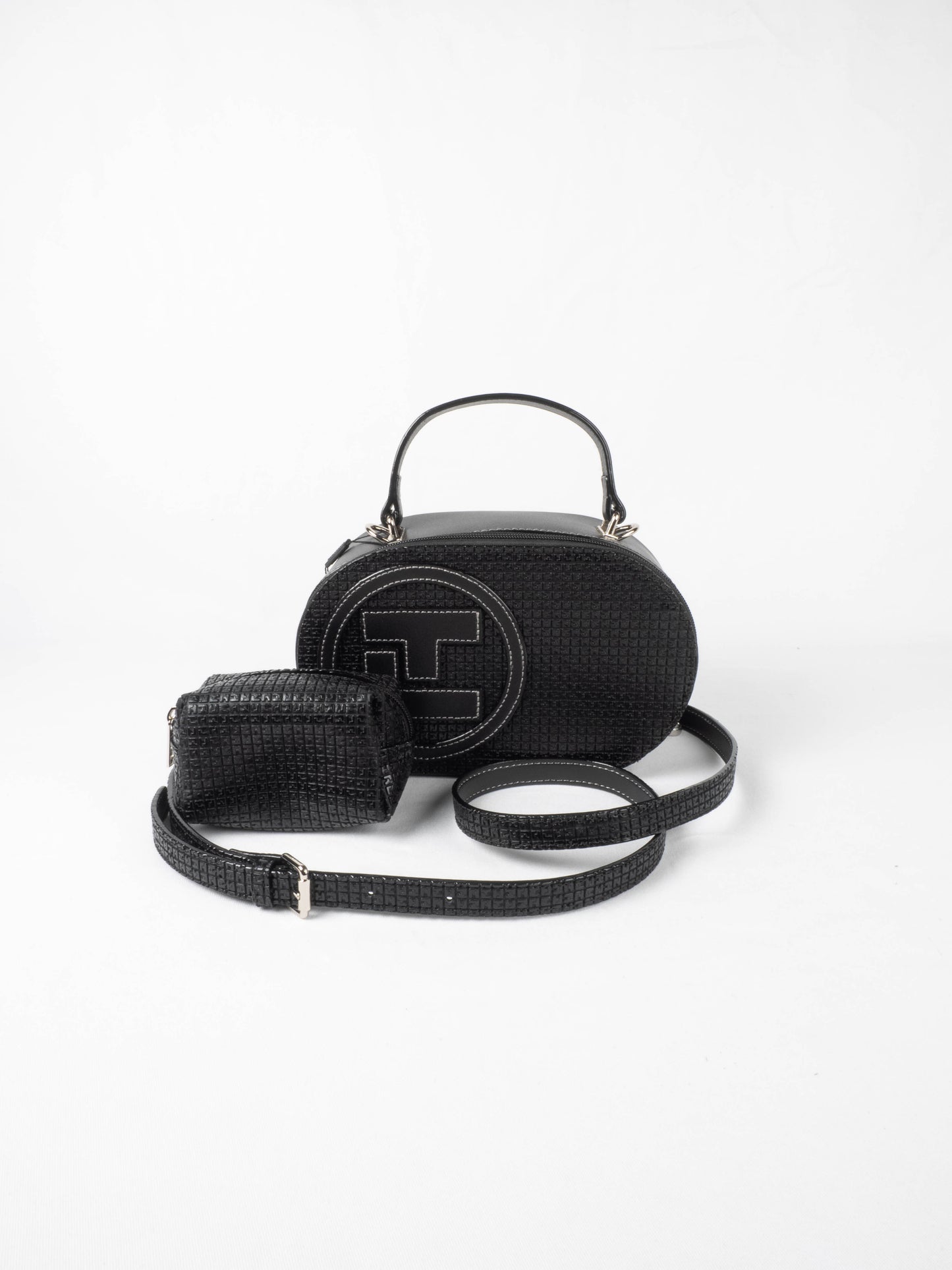 Sac à main Ted Lapidus Fidelio pilule en cuir noir avce bandoulière et porte monnaie